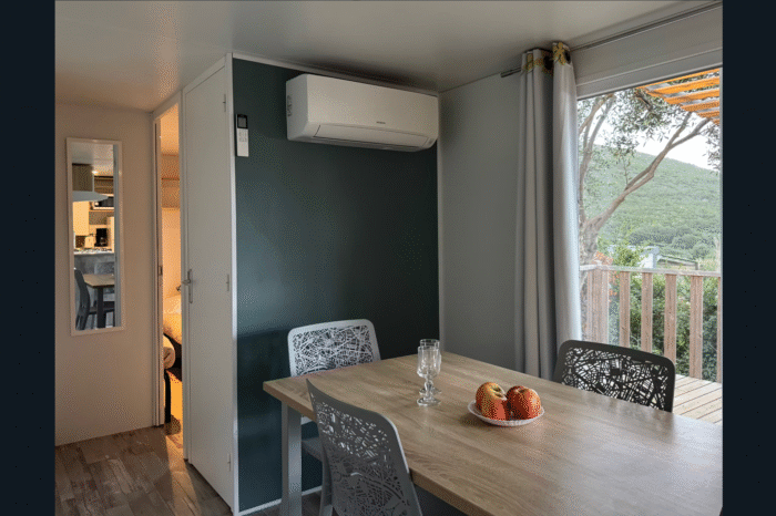 camping vista mare cap corse bungalow famille table repas clim